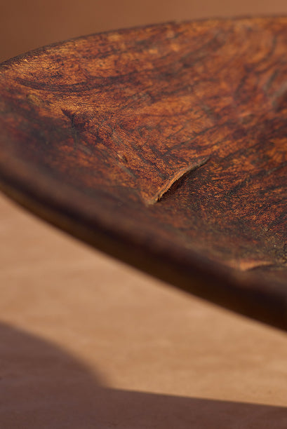Moroccan walnut couscous bowl — surface scarring and patina detail.