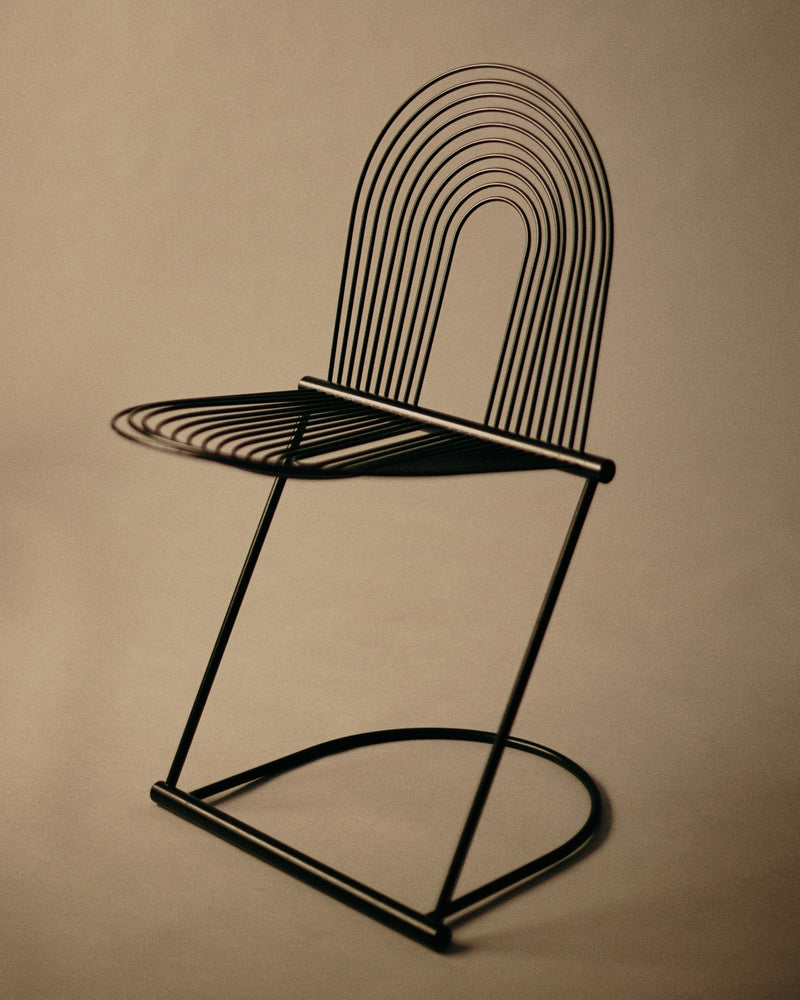 Rosenthal Swing chair — side/three-quarter view, sprung steel frame.