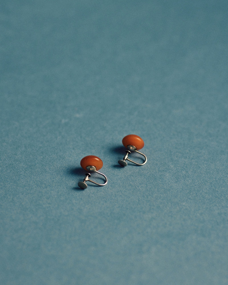 Amber and sterling silver earrings — fluted detail and screw-on mechanism, c.1930s.