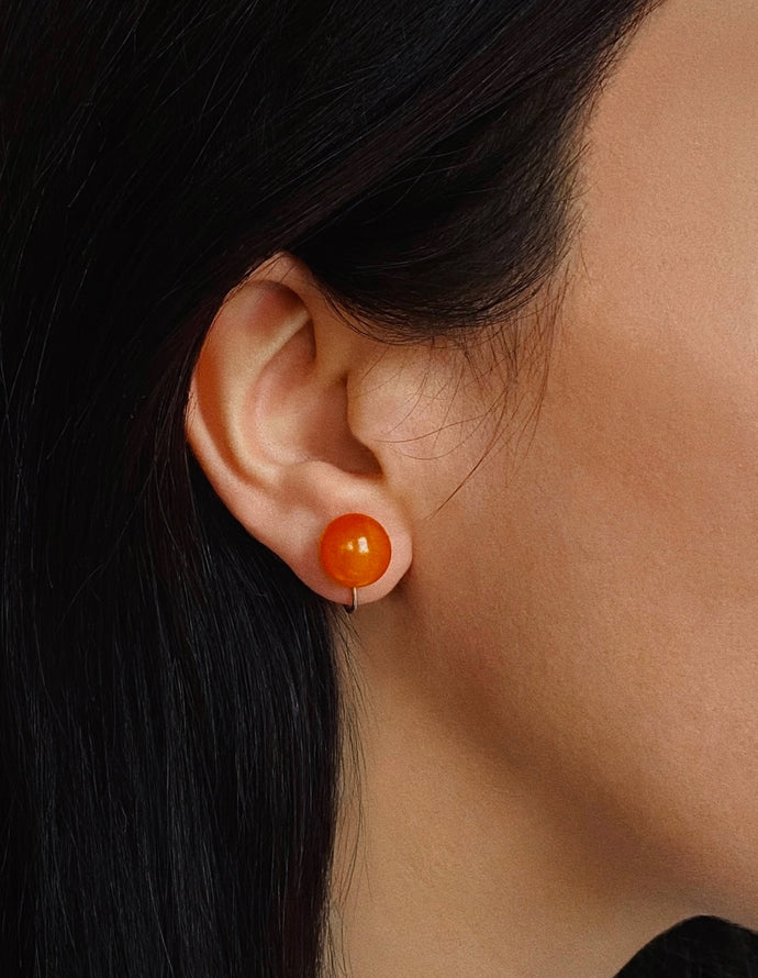 Amber and sterling silver screw-on earrings (925), c.1930s — worn on ear.