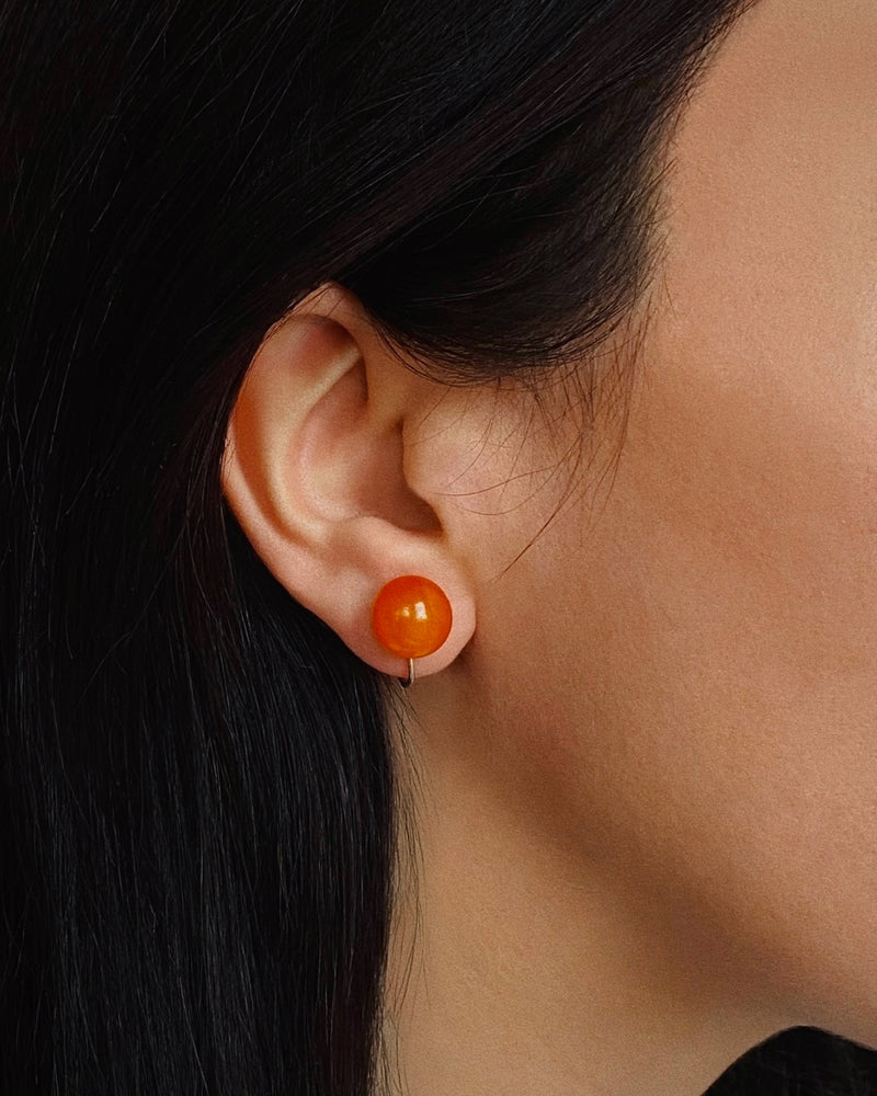 Amber and sterling silver screw-on earrings (925), c.1930s — worn on ear.