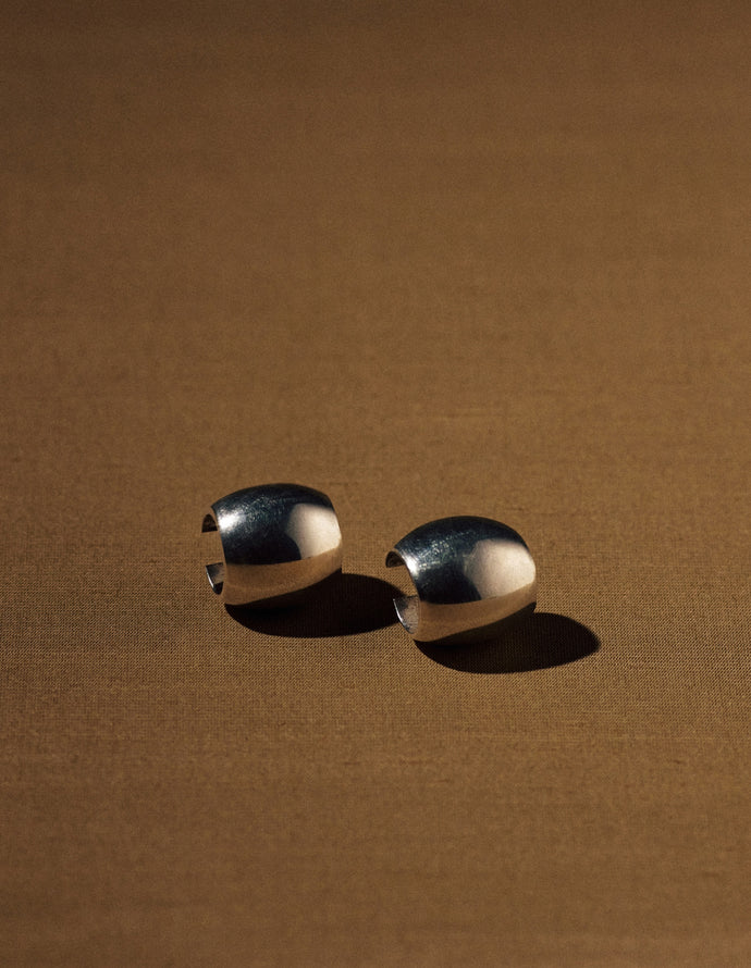 French Art Deco wide hoop earrings in sterling silver (925) — pair, studio view.