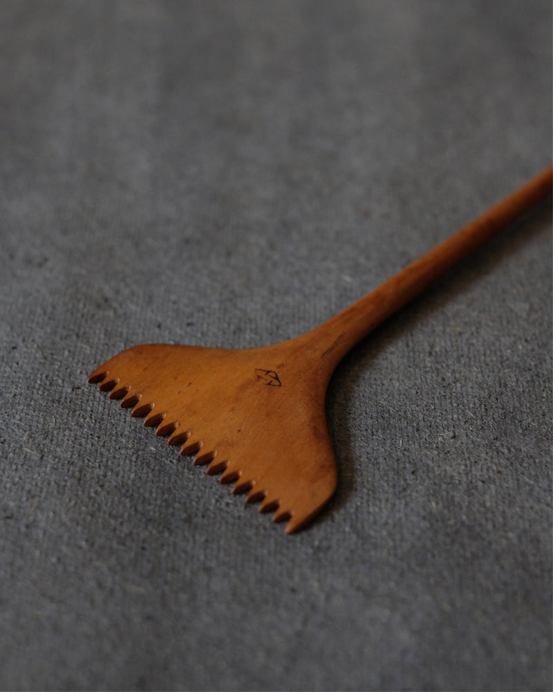 Close-up of small handmade Japanese maple wood comb