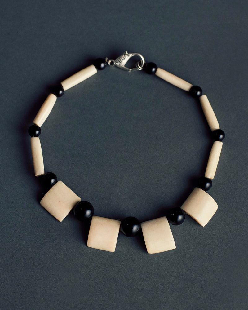 Carved bone and bead necklace, 20th century — full view.