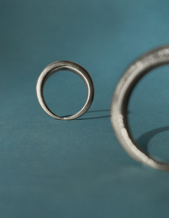 Berber (Amazigh) silver ring duo, Ouarzazate — two rings, studio view.