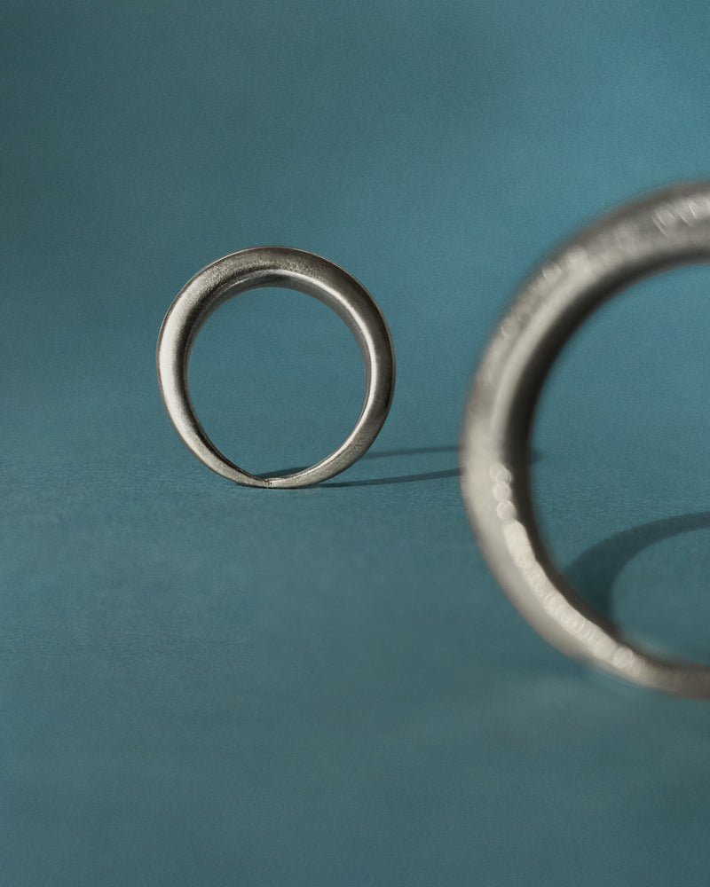 Berber (Amazigh) silver ring duo, Ouarzazate — two rings, studio view.