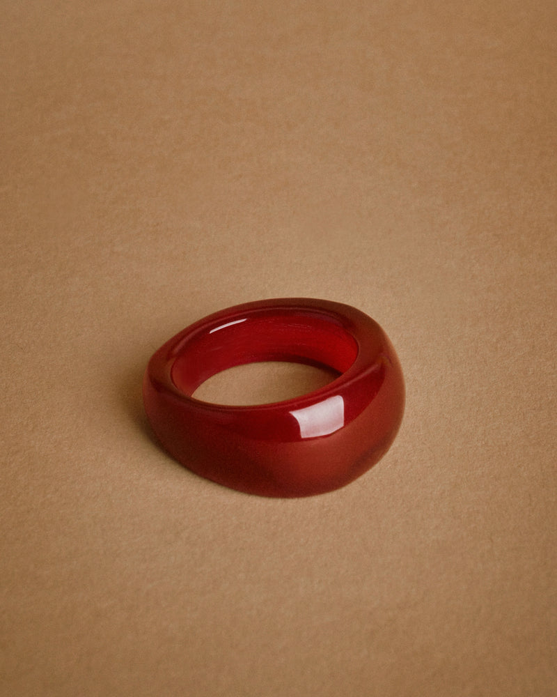 Red onyx ring, late 20th century — front view, polished finish.