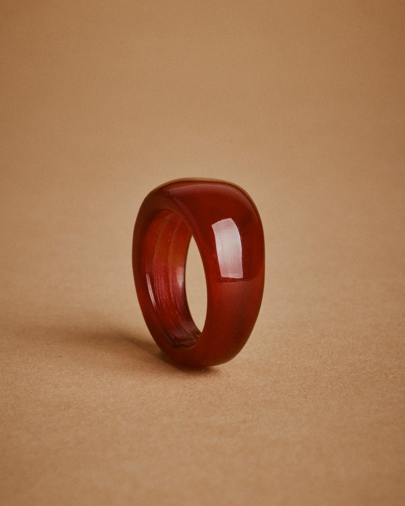 Red onyx ring, late 20th century — side profile, domed band.